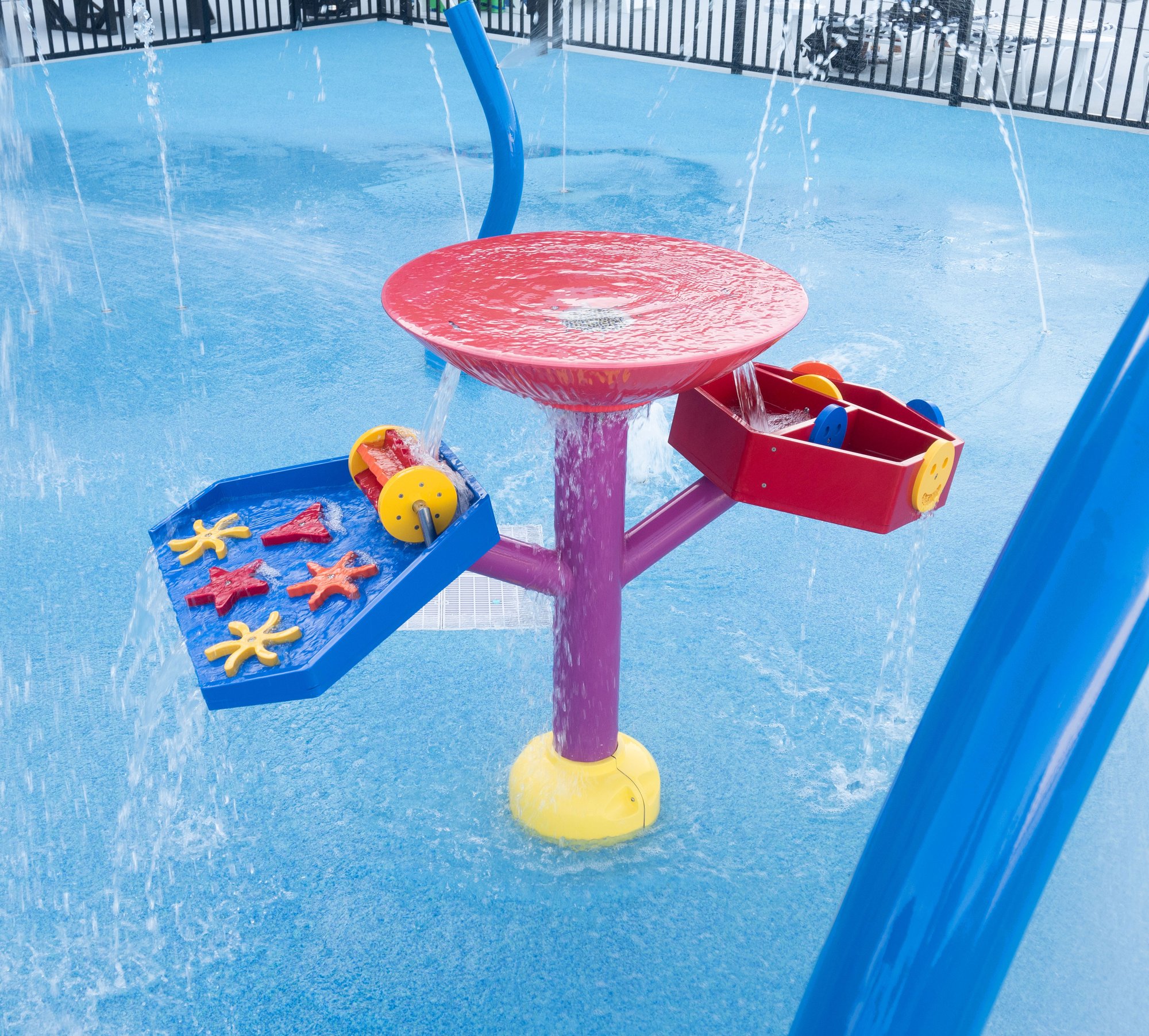 water play table on a splash pad