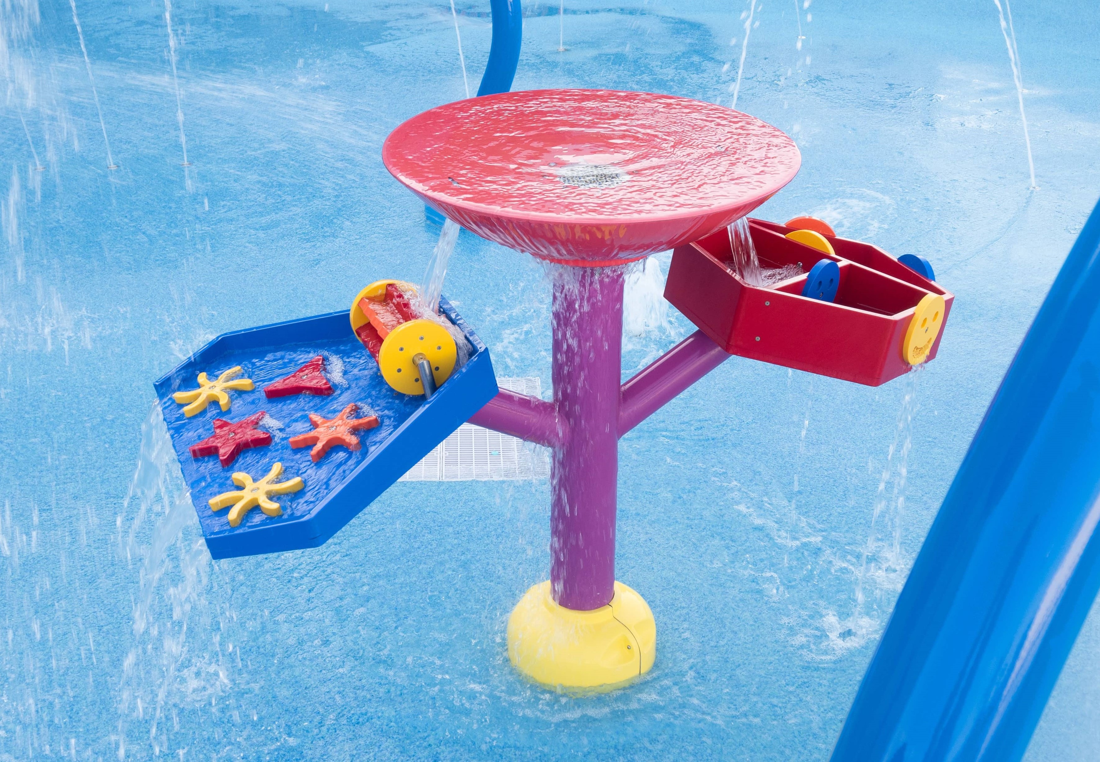 water play table on a splash pad